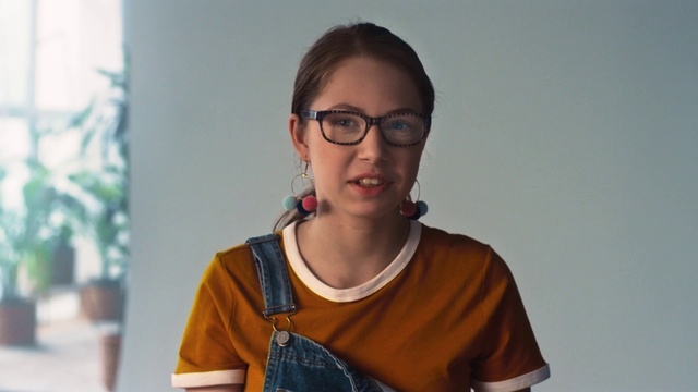 Video Reference: Eyewear, Hair, Glasses, Vision care, Shoulder, Cool, Facial hair, Neck, T-shirt, Smile