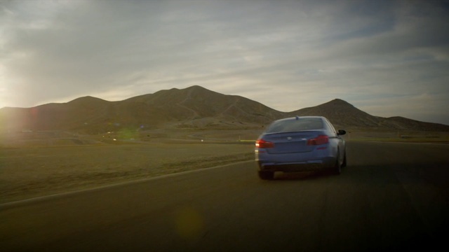 Video Reference: road, car, ecosystem, sky, mountainous landforms, road trip, infrastructure, mode of transport, highway, vehicle