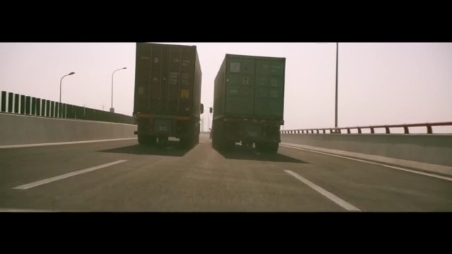 Video Reference: expressway, trailer, truck, road, highway, transportation, transport, car, cargo, vehicle, sky, shipping, traffic, lorry, delivery, industry, freight, street, travel, trailer truck, speed