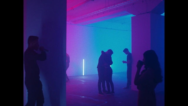 Video Reference: Blue, Purple, Violet, Light, Magenta, Electric blue, Sky, Design, Fun, Shadow, Person, Man, Looking, Standing, Cellphone, Phone, Screen, Front, Monitor, Holding, Talking, Television, Dark, Watching, Laptop, Room, Woman, Computer, Video, Walking, Remote, Street, Playing, Large, Flying, Game, Dance, Clothing