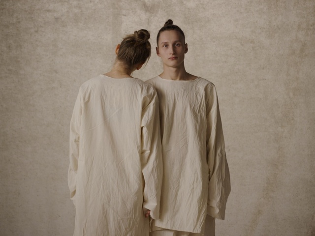 Video Reference: White, Clothing, Fashion, Outerwear, Sleeve, Dress, Neck, Fashion design, Beige, Robe, Person