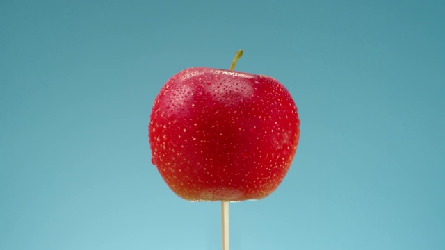 Video Reference: Apple, Natural foods, Fruit, Red, Food, Plant, Accessory fruit, Seedless fruit, Tree, Cherry, Sitting, Stop, Sign, Table, Orange, Close, Blue, Perched, White, Traffic, Plane, Standing, Strawberry