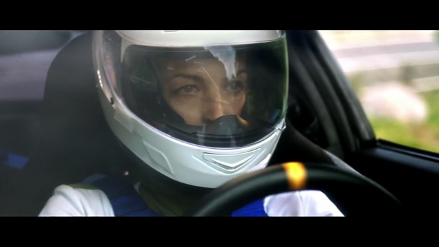 Video Reference: car, vehicle, mode of transport, motor vehicle, automotive design, personal protective equipment, helmet, vehicle door, windshield, glass, Person