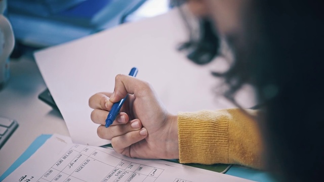 Video Reference: Text, Writing instrument accessory, Writing, Hand, Handwriting, Finger, Font, Nail, Adaptation, Drawing, Person, Using, Sitting, Computer, Holding, Paper, Laptop, Desk, Man, Table, Keyboard, Phone, Office supplies, Pen, Child art, Watch, Cosmetics, Document