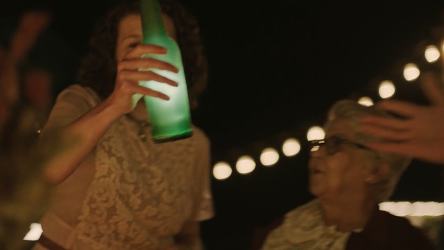 Video Reference: event, hand, human body, finger, human, performance, tradition, night, performance art, darkness