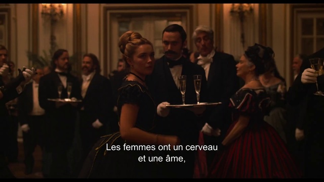 Video Reference: Photograph, Event, Fun, Dress, Photo caption, Performance, Gentleman, Screenshot, Darkness, Person, Indoor, Photo, Man, Holding, Group, Standing, People, Room, Front, Looking, Woman, Posing, Large, Wearing, Young, Black, Screen, Mirror, Ball, Playing, Player, Video, Crowd, Human face, Clothing, Suit, Smile, Bowed instrument