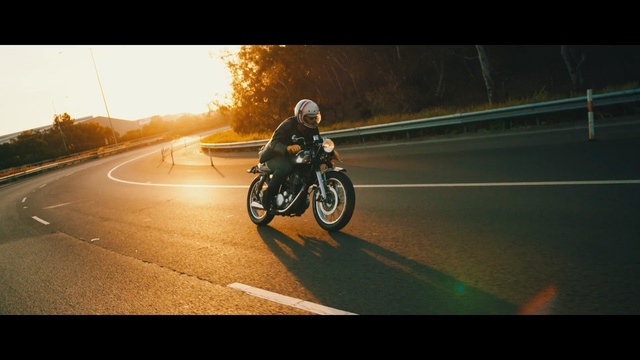 Video Reference: land vehicle, car, motorcycle, yellow, motorcycling, vehicle, mode of transport, sky, lane, light