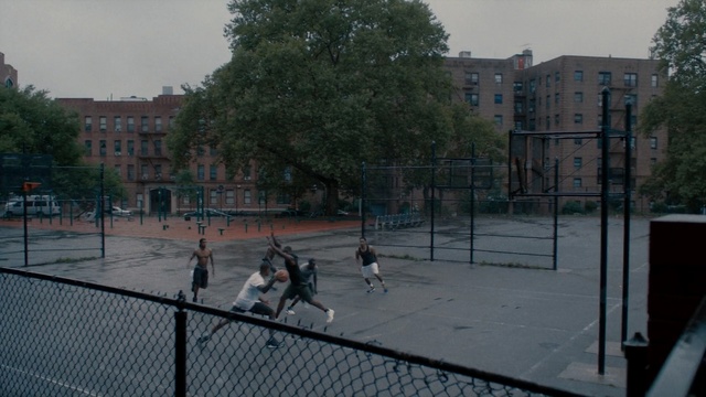 Video Reference: Public space, Tree, Sport venue, City, Fence, Architecture, Net, Roof, Urban design, Residential area