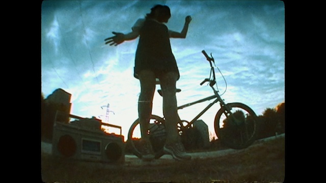 Video Reference: cycle sport, sky, bicycle, mode of transport, extreme sport, freestyle bmx, bmx bike, skateboarder, sports equipment, stunt performer