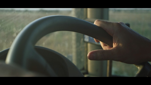 Video Reference: mode of transport, close up, hand, automotive design, car, vehicle, driving, audio equipment, sky, angle