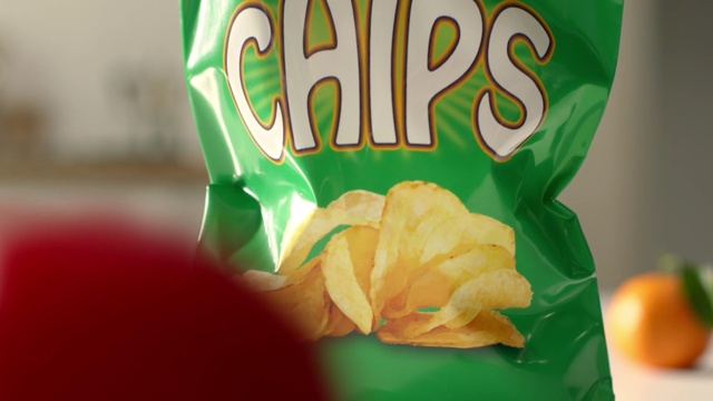 Video Reference: green, junk food, sweetness, potato chip, petal, snack, Person