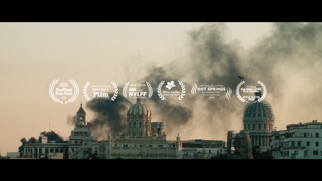 Video Reference: Atmospheric phenomenon, Sky, Font, City, Human settlement, Urban area, Cloud, Metropolis, Metropolitan area, Atmosphere