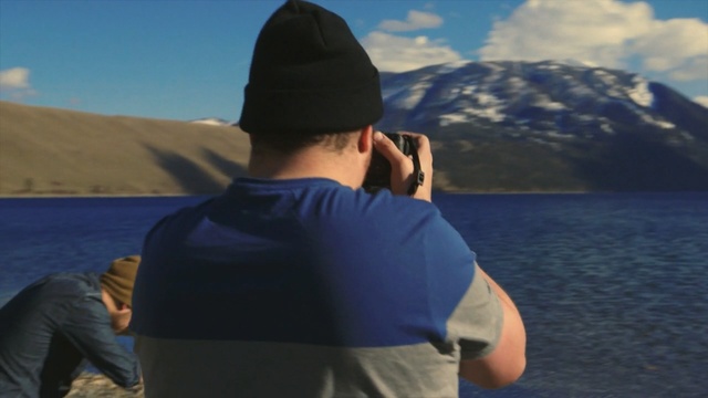 Video Reference: sky, vacation, water, mountainous landforms, sea, headgear, cloud, fun, mountain, ocean
