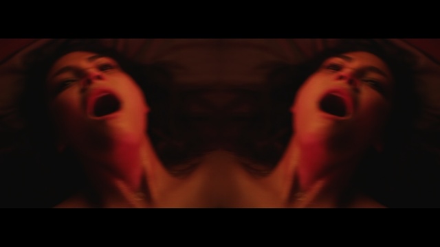 Video Reference: Facial expression, Red, Nose, Mouth, Fiction, Flesh, Darkness, Organ, Human, Music