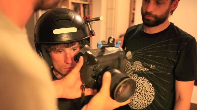 Video Reference: arm, facial hair, audio, personal protective equipment, headgear, hand, finger, audio equipment, Person