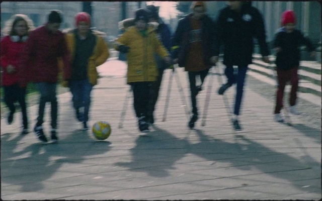 Video Reference: Ball, Winter, Street football, Sports, Sports equipment, Pedestrian, Recreation, Competition event, Walking, Team sport
