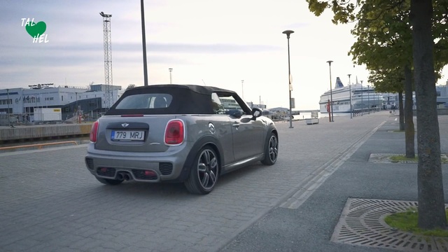 Video Reference: Land vehicle, Vehicle, Car, Mini, City car, Mini cooper, Subcompact car, Automotive design, Parking, Road, Outdoor, Street, Scene, Highway, City, Intersection, Truck, Green, Traffic, Driving, Side, Parked, Light, Stop, Busy, Riding, Pole, Yellow, Man, Station, Red, Sign, White, Motorcycle, Bus, People, Sky, Text, Wheel, Automotive, Way, Luxury vehicle, Mid-size car, Personal luxury car, Tire, Crossover suv, Auto part, Vehicle registration plate, Day, Curb