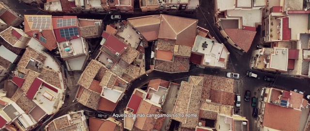 Video Reference: Wall, Urban area, Brick, Design, Roof, Photography, Pattern, Facade, Aerial photography, Residential area