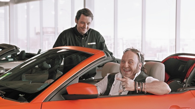 Video Reference: car, motor vehicle, land vehicle, vehicle, automotive design, automotive exterior, personal luxury car, windshield, sports car, vehicle door, Person