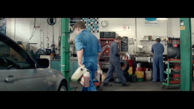 Video Reference: Automobile repair shop, Motor vehicle, Auto mechanic, Snapshot, Standing, Mode of transport, Arm, Vehicle, Car, Auto part, Person