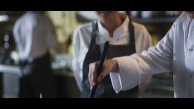 Video Reference: Sleeve, Gesture, Font, Formal wear, Street fashion, Event, Dress shirt, White-collar worker, Display device, Wrist