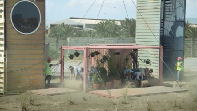 Video Reference: roof, outdoor structure, window, facade, house, shed, recreation, tree, Person