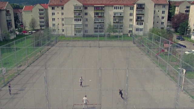 Video Reference: Sport venue, Residential area, Architecture, Urban design, Condominium, Building, Net, Roof, Suburb, City