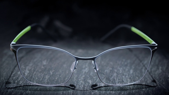 Video Reference: Eyewear, Glasses, Green, Personal protective equipment, Transparent material, Vision care, Sunglasses, Still life photography, Close-up, Spectacle