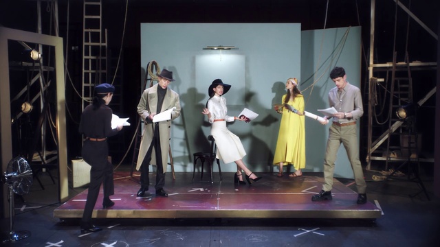 Video Reference: Performance, Heater, Drama, Performing arts, Stage, Performance art, Scene, Acting, Event, Theatrical property, Person, Indoor, Man, Table, Standing, Holding, People, Woman, Room, Group, Walking, Playing, Living, Video, Young, Game, Wii, Clothing, Dance, Floor, Dress, Concert