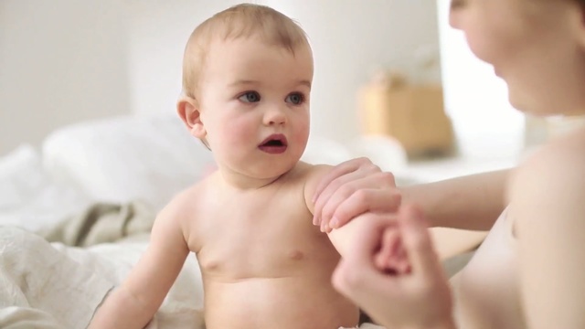 Video Reference: diaper, garment, child, clothing, baby, covering, consumer goods, infant, childhood, kid, little, cute, toddler, adorable, care, portrait, face, innocence, boy, happy, newborn, innocent, commodity, eyes, Person