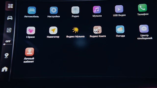 Video Reference: car infotainment, touchscreen, dashboard, app icons, Russian text, navigation, music, radio, settings, weather, phone, media, vehicle UI, menu, screen
