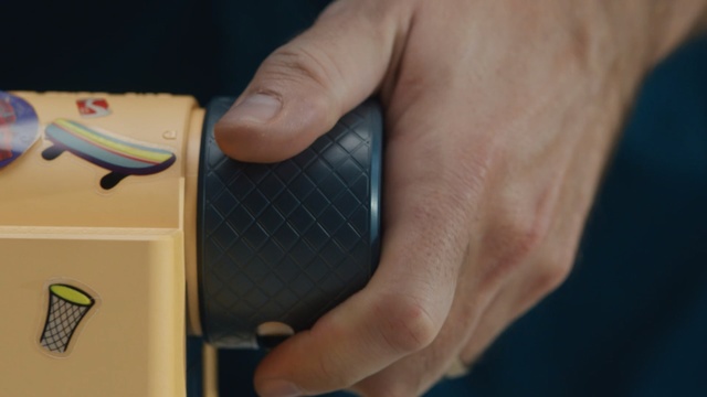 Video Reference: Finger, Hand, Thumb, Shoe, Nail, Person, Indoor, Holding, Man, Food, Small, Front, Table, Using, Keyboard, Computer, Black, Cutting, Plate, White, Player, Blue, Mobile phone