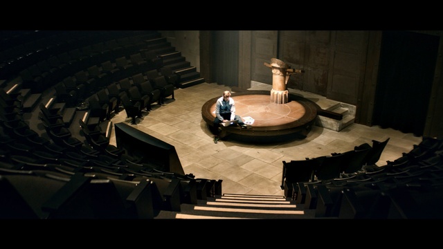 Video Reference: darkness, musical instrument accessory, theatre, scene, auditorium, screenshot, theatre