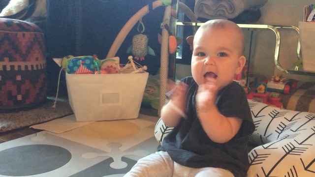 Video Reference: day, toddler, child, sitting, arm, product, infant, play, fun, Person