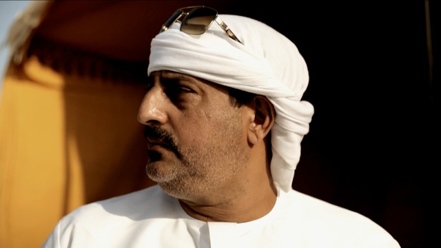 Video Reference: Forehead, Headgear, Human, Facial hair, Cap, Turban, Moustache, Beard, Person