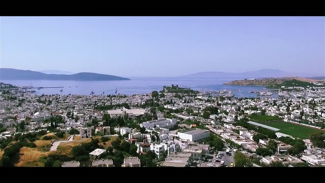 Video Reference: Sky, Coast, Sea, Town, Residential area, Human settlement, Bay, Suburb, Tourism, Village