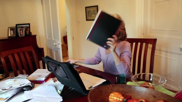 Video Reference: Sitting, Room, Meal, Furniture, Electronic device, Breakfast, Technology, Eating, Table, Desk, Person