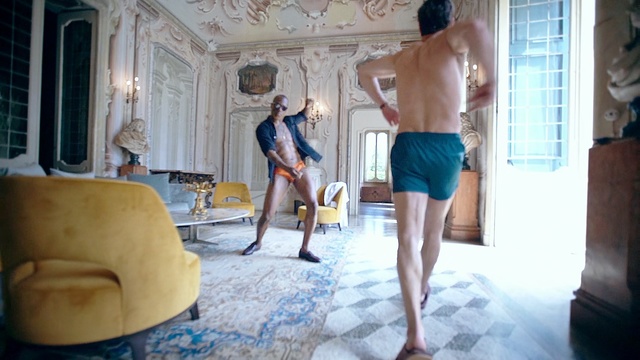 Video Reference: Room, Male, Leg, Barechested, Fun, Interior design, Vacation, Furniture, Person