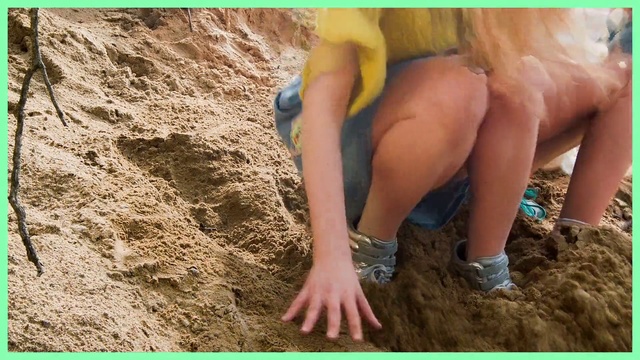 Video Reference: Soil, Leg, Sand, Fun, Mud, Hand, Adventure, Recreation, Person, Outdoor, Rock, Sitting, Woman, Young, Boy, Man, Holding, Brown, Girl, Green, Laying, White, Standing, Playing, Surfing, Bird, Water, Beach, Cat, Riding, Swimwear, Clothing, Barefoot