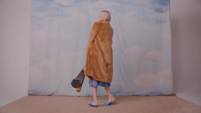 Video Reference: Fashion, Fur, Footwear, Beige, Textile, Outerwear, Linens, Shoe, Dress, Human leg