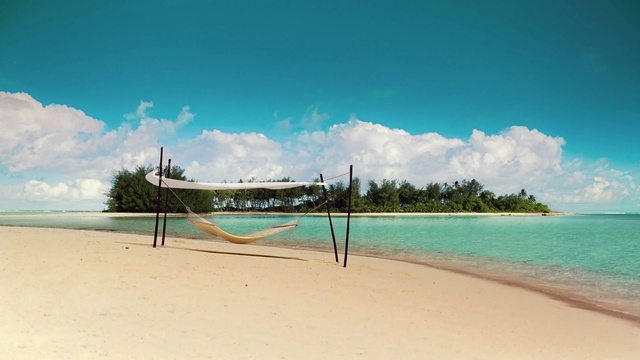 Video Reference: volleyball net, net, game equipment, beach, equipment, sand, sea, ocean, water, travel, vacation, landscape, coast, sky, sport, island, shore, tropical, holiday, summer, Person