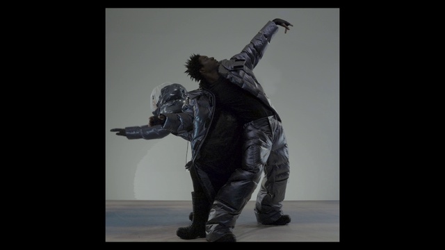 Video Reference: Gesture, Grey, Art, Font, Performing arts, Statue, Sculpture, Monochrome photography, Entertainment, Event