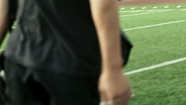 Video Reference: footwear, player, grass, joint, shoulder, shoe, leg, trunk, arm, muscle, Person