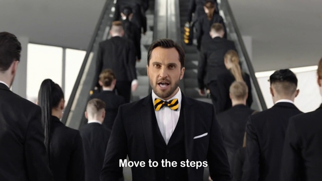Video Reference: Suit, Formal wear, White-collar worker, Tuxedo, Event, Businessperson, Management, Smile