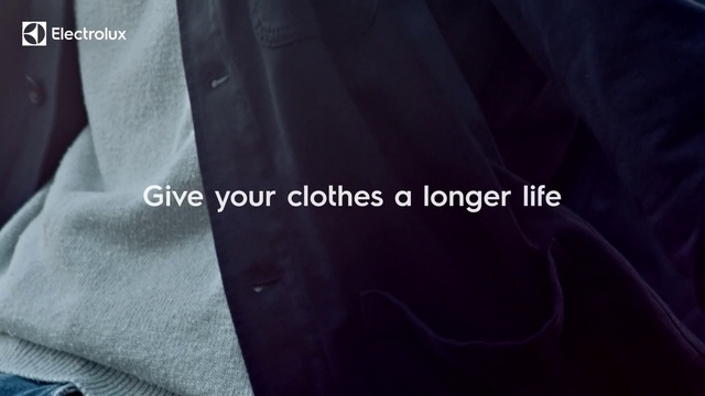 Video Reference: Suit, Font, Textile, Formal wear, Jersey, Outerwear, Material property, Sportswear, Neck, Brand