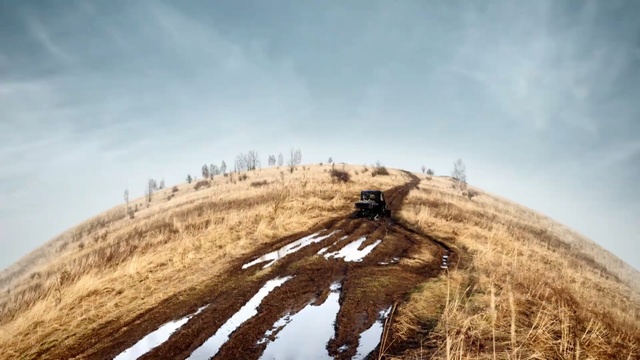 Video Reference: sky, mountainous landforms, ridge, mountain, hill, grass family, grassland, mountain range, tree, cloud