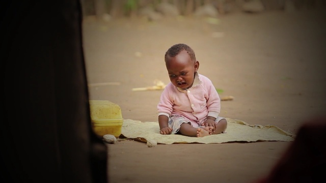 Video Reference: photograph, person, yellow, child, sitting, snapshot, girl, human, infant, fun