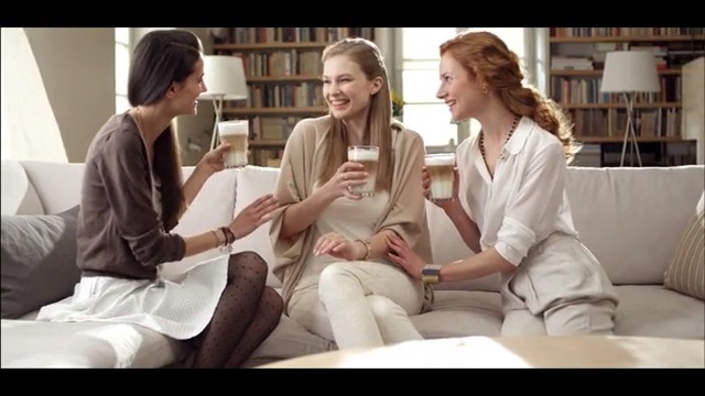 Video Reference: Sitting, Conversation, Fun, Human, Leg, Mouth, Electronic device, White-collar worker, Happy, Comfort, Person, Woman, Indoor, Window, People, Man, Looking, Couple, Table, Holding, White, Girl, Young, Room, Suit, Group, Standing, Playing, Smile, Clothing, Human face, Text