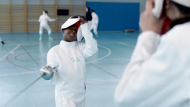 Video Reference: sport venue, competition, sports, joint, competition event, leisure, recreation, personal protective equipment, fencing, Person