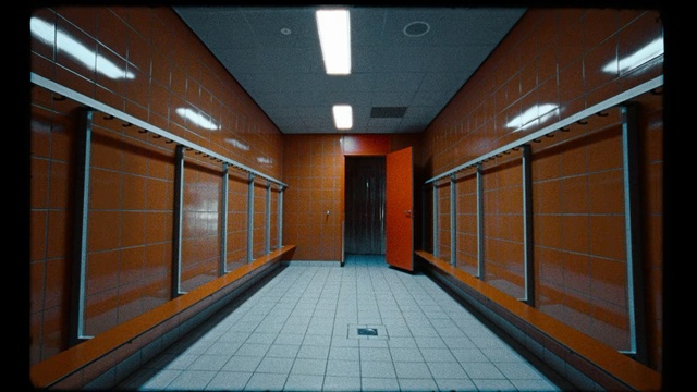 Video Reference: Building, Architecture, Room, Hall, Door, Aisle, Platform, Floor, Sidewalk, Sitting, Wooden, Yellow, Bench, Rail, Table, Side, Brick, Train, Large, Orange, Board, White, Station, Track, Standing, Man, Riding, Window